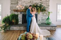 Newly weds getting cozy by the fireplace