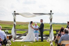 Waterfront ceremony - Couple exchanging vows